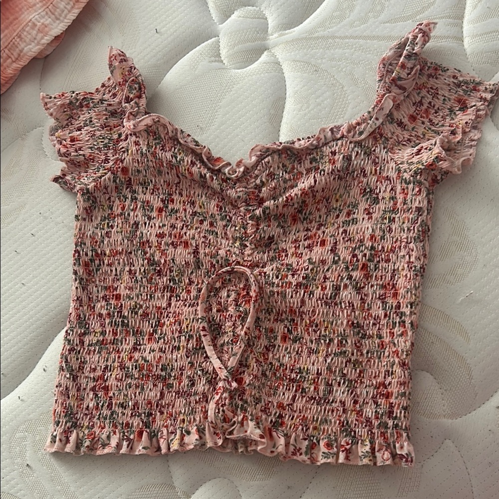 Pink Smocked Blouse with Ruffled Flutter Sleeves and Tie Front